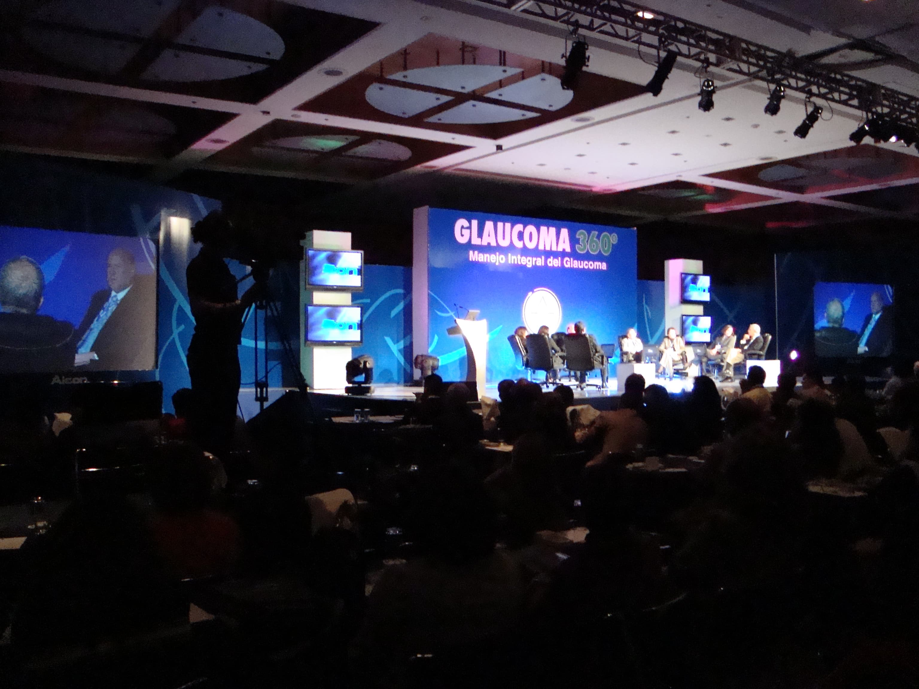 Alcon congress stage with screens, cameras and audience